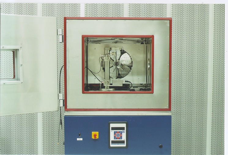 Open laboratory heat and cold chamber with a test fixture inside.